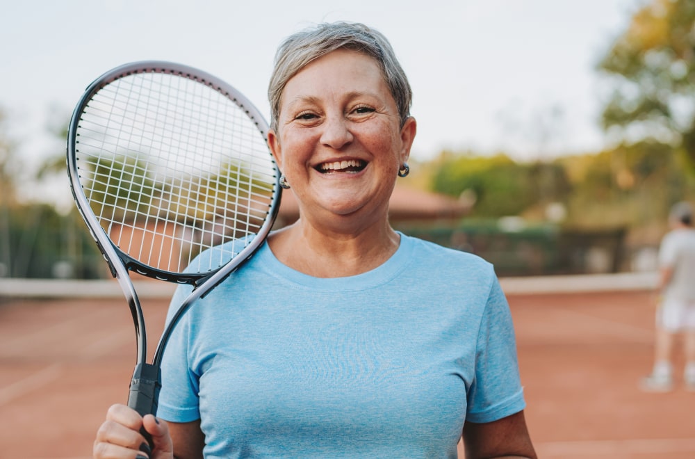a happy woman is holding a bracket